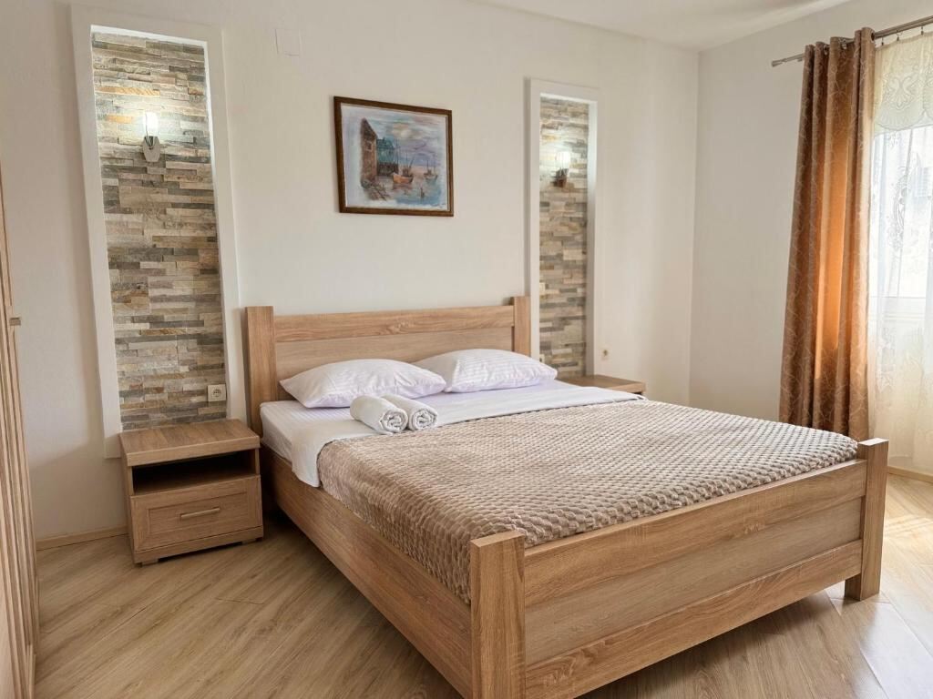 Bright bedroom with wooden furniture